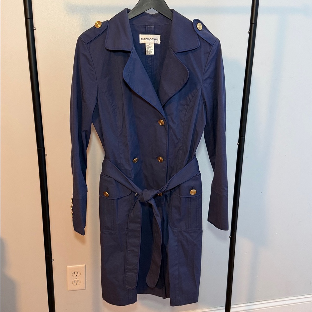Women’s Bloomingdale’s royal blue trench coat.
